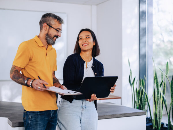 Couple speaking to an estate agent in Solihull before selling their home